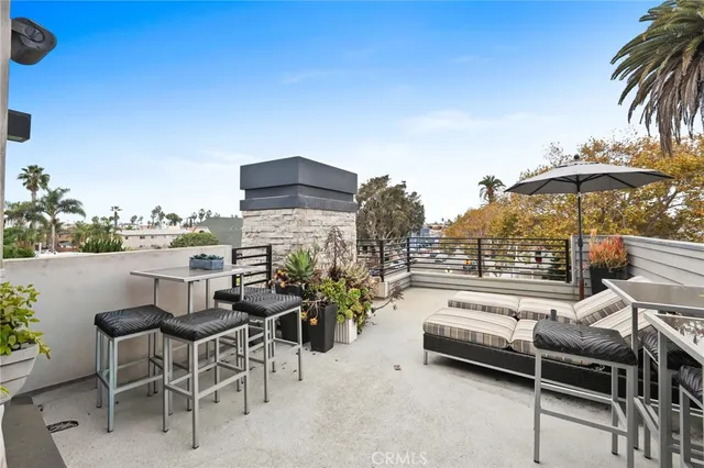 a view of a terrace with furniture and a patio