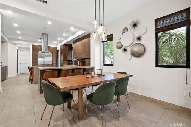 a kitchen with a table and chairs