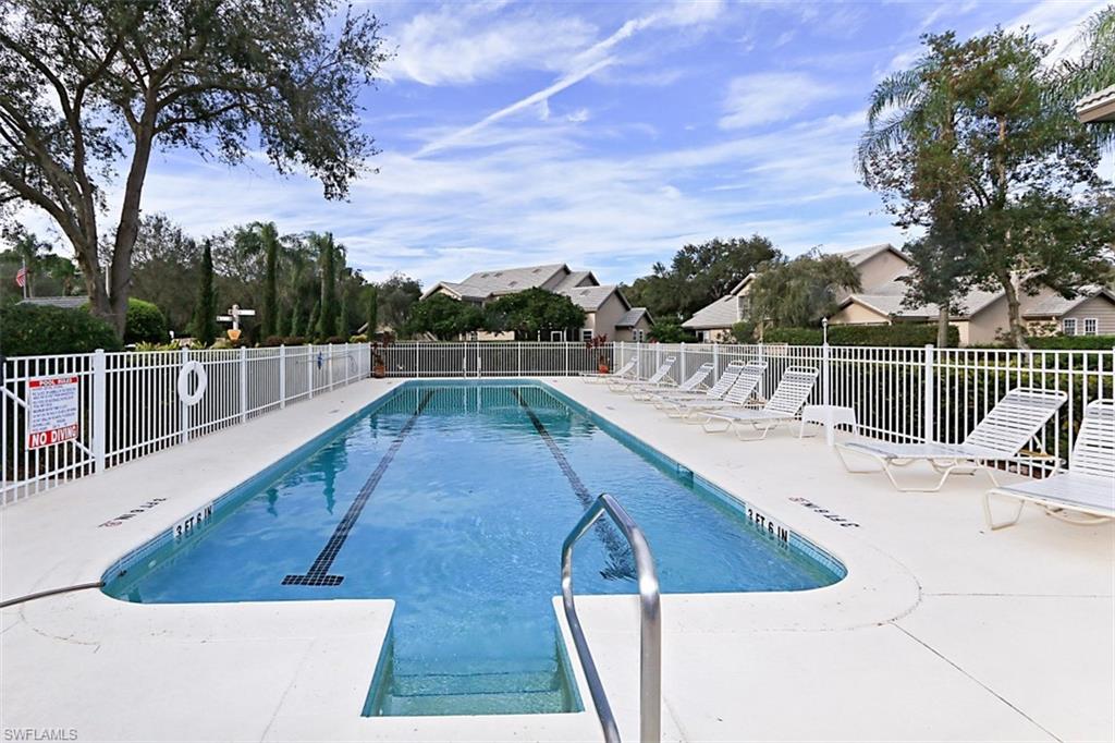 a view of a swimming pool with a lounge chair