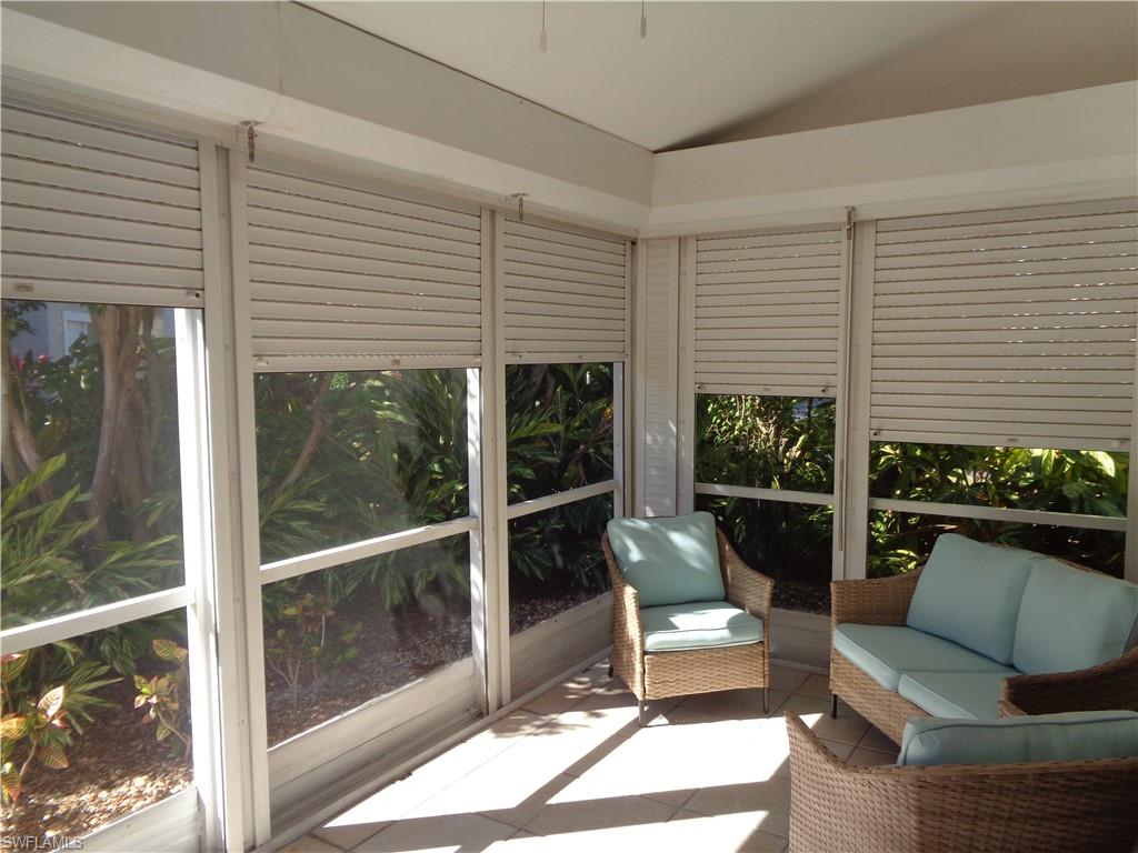 264 Perignon Place, Unit 113 Naples, FL 34119 - Photo 14 of 15 a living room filled with furniture
