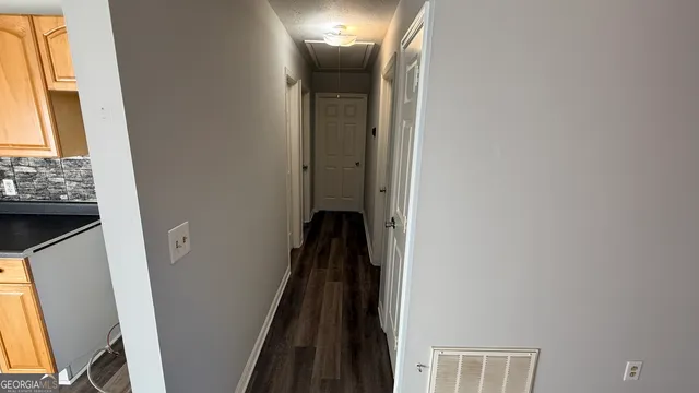 a view of a hallway with a window