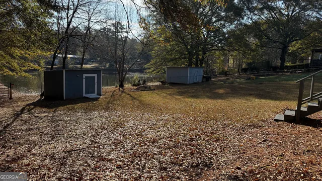a view of a outdoor space with shower and trees