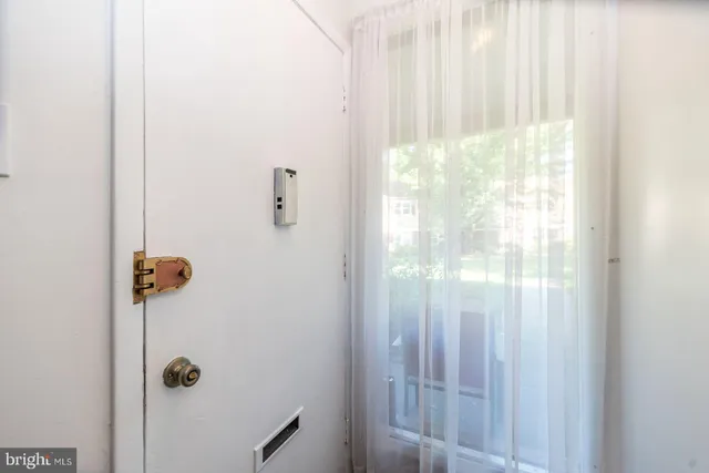 a bathroom with a glass shower door