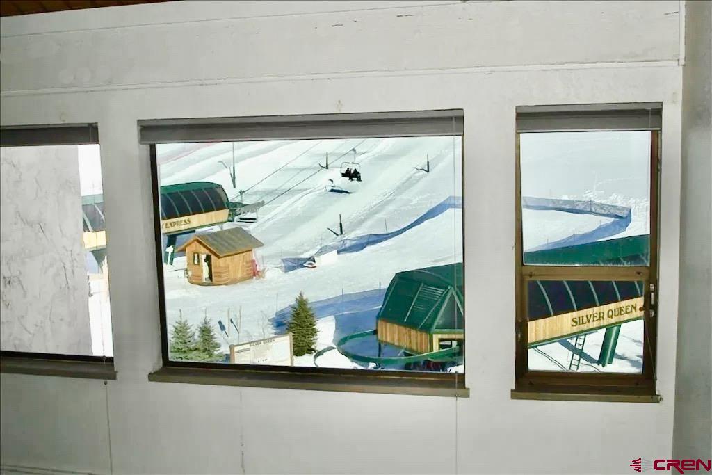 12 Snowmass Road, Unit AXTEL #415 Crested Butte, CO 81225 - Photo 14 of 35 view of front door with glass door