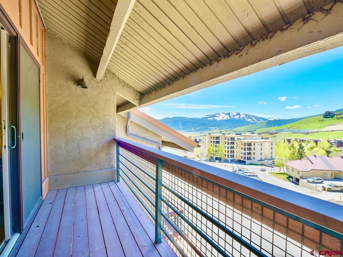 12 Snowmass Road, Unit AXTEL #415 Crested Butte, CO 81225 - Photo 16 of 35 a view of balcony with wooden floor