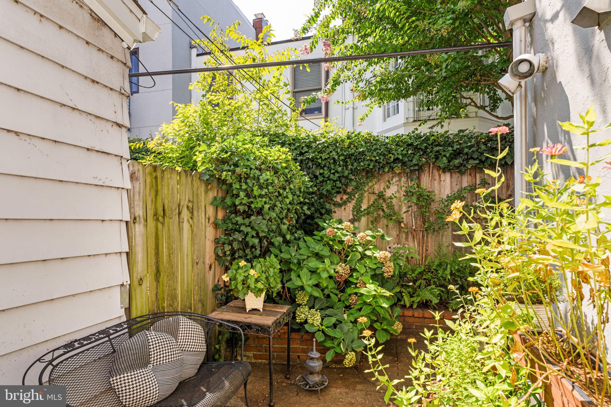 2410 Panama Street Philadelphia, PA 19103 - Photo 19 of 50 a backyard of a house with outdoor seating and green space