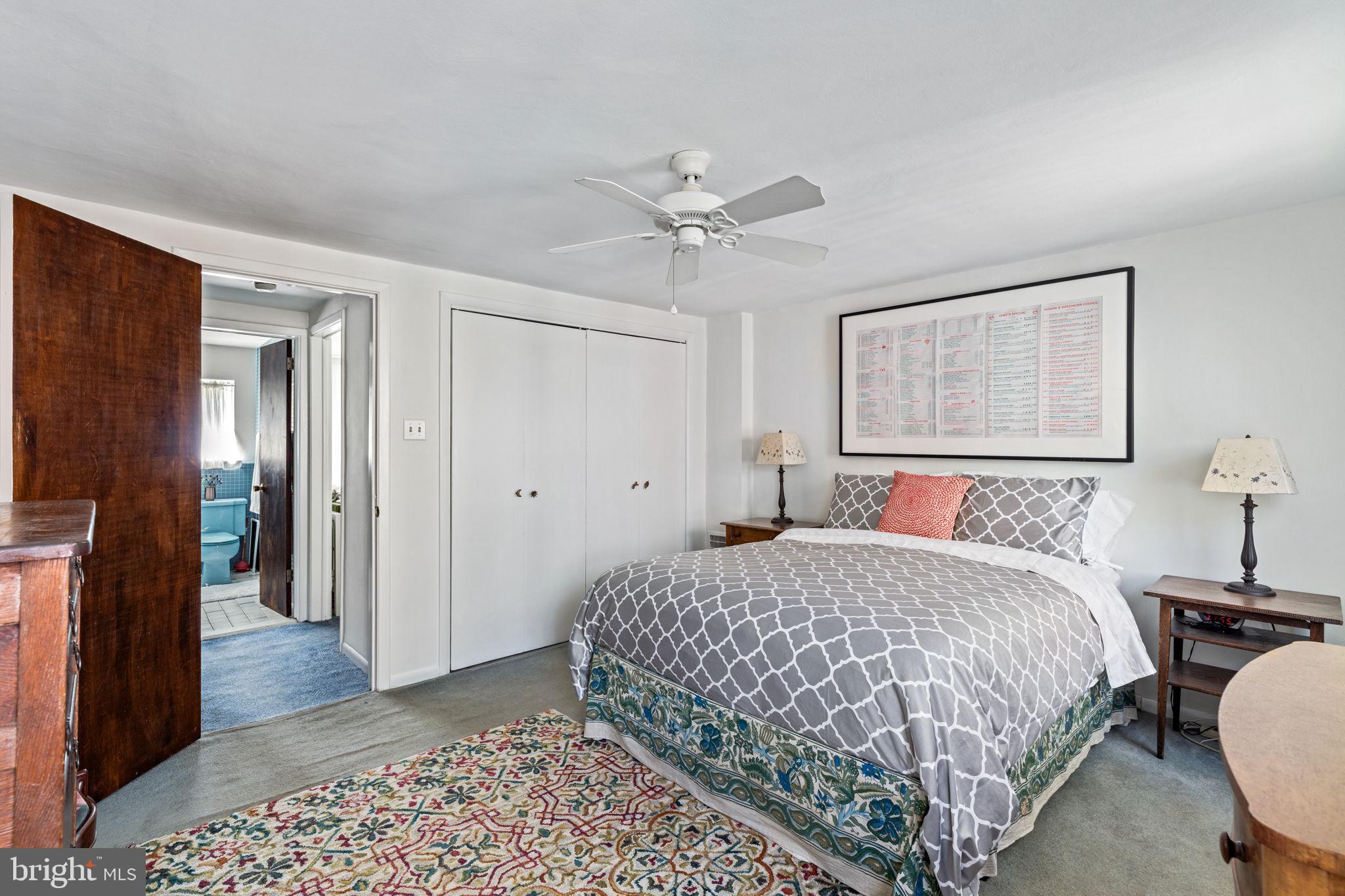 2410 Panama Street Philadelphia, PA 19103 - Photo 24 of 50 a bedroom with a bed and a chandelier