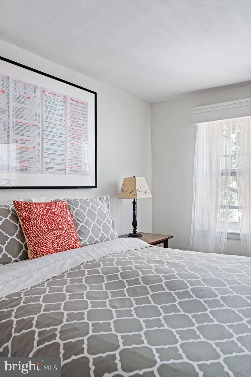 2410 Panama Street Philadelphia, PA 19103 - Photo 26 of 50 a bedroom with a large bed and a window
