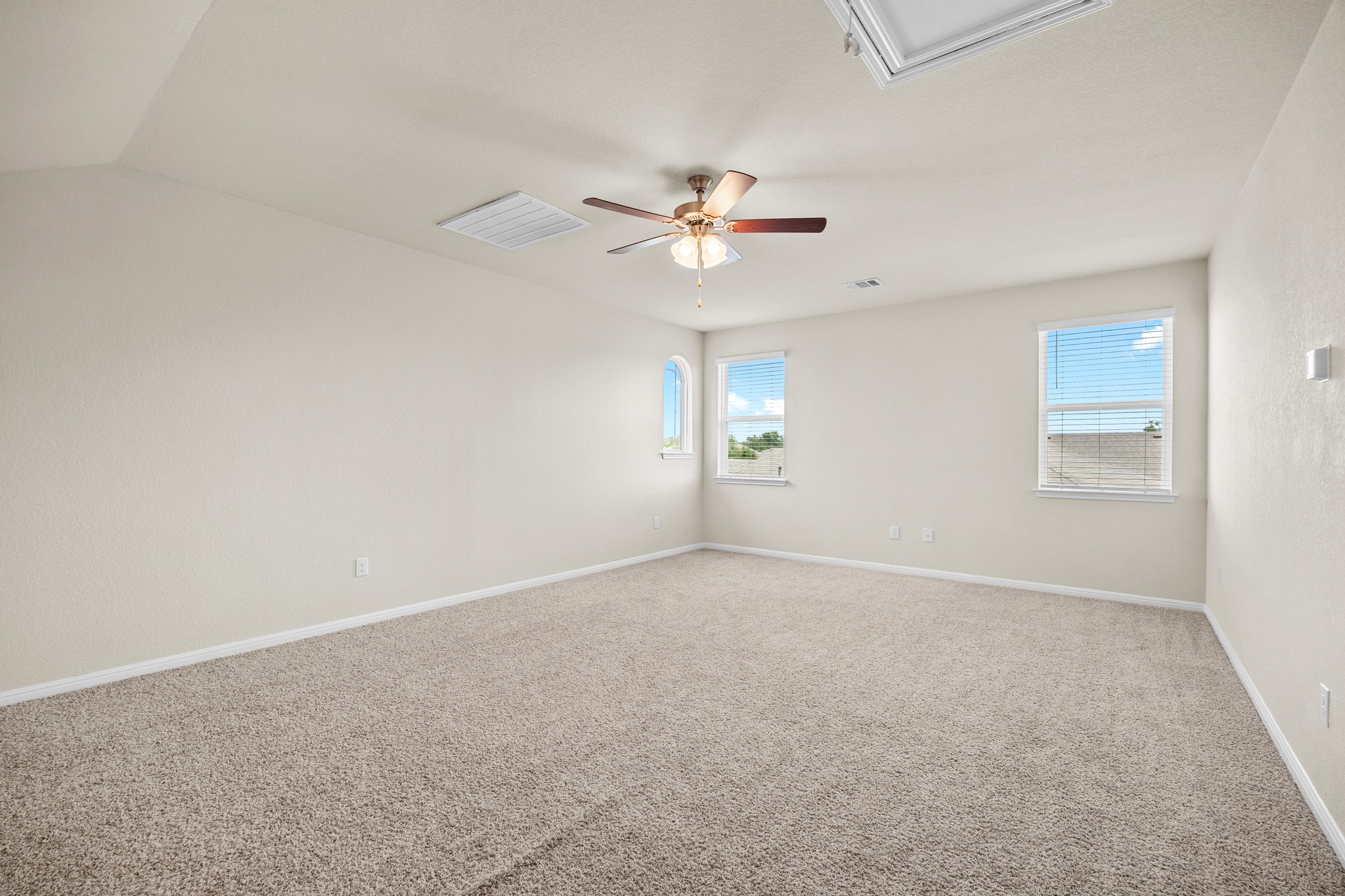 2413 Starhill Ranch Street Georgetown, TX 78628 - Photo 26 of 40 an empty room with windows and fan