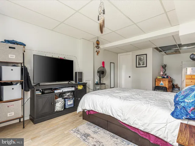 a bathroom with a sink vanity mirror and toilet