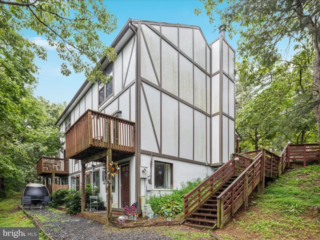 a picture of a park with a white wall