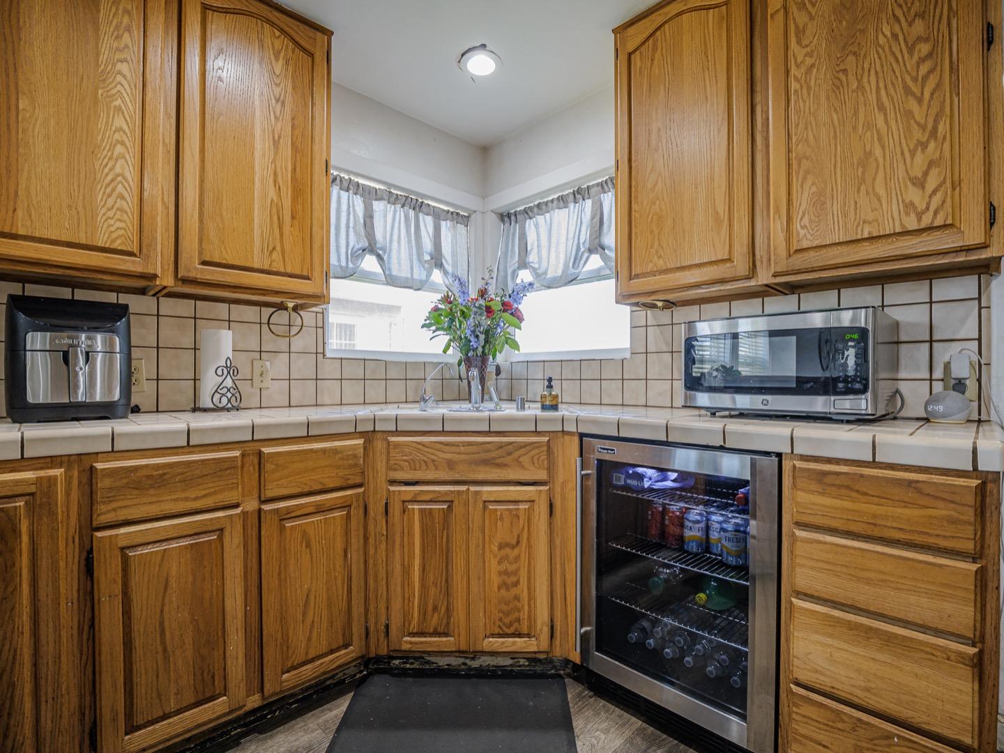 27 Burchell Avenue Watsonville, CA 95076 - Photo 12 of 27 a kitchen with stainless steel appliances granite countertop a sink and cabinets