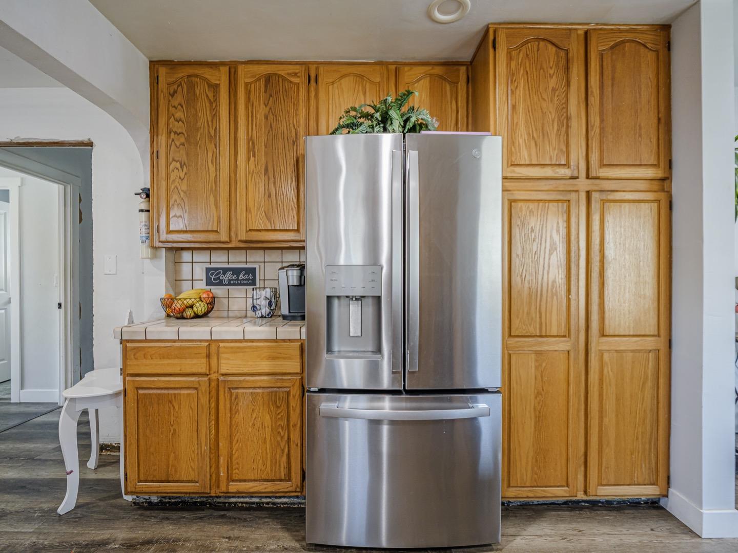 27 Burchell Avenue Watsonville, CA 95076 - Photo 13 of 27 a kitchen with a refrigerator a washer and dryer