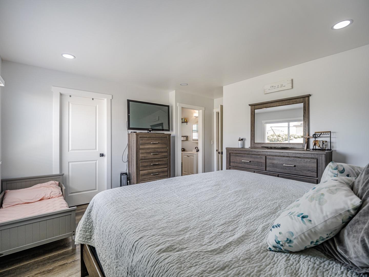 27 Burchell Avenue Watsonville, CA 95076 - Photo 16 of 27 a bedroom with a bed and a couch