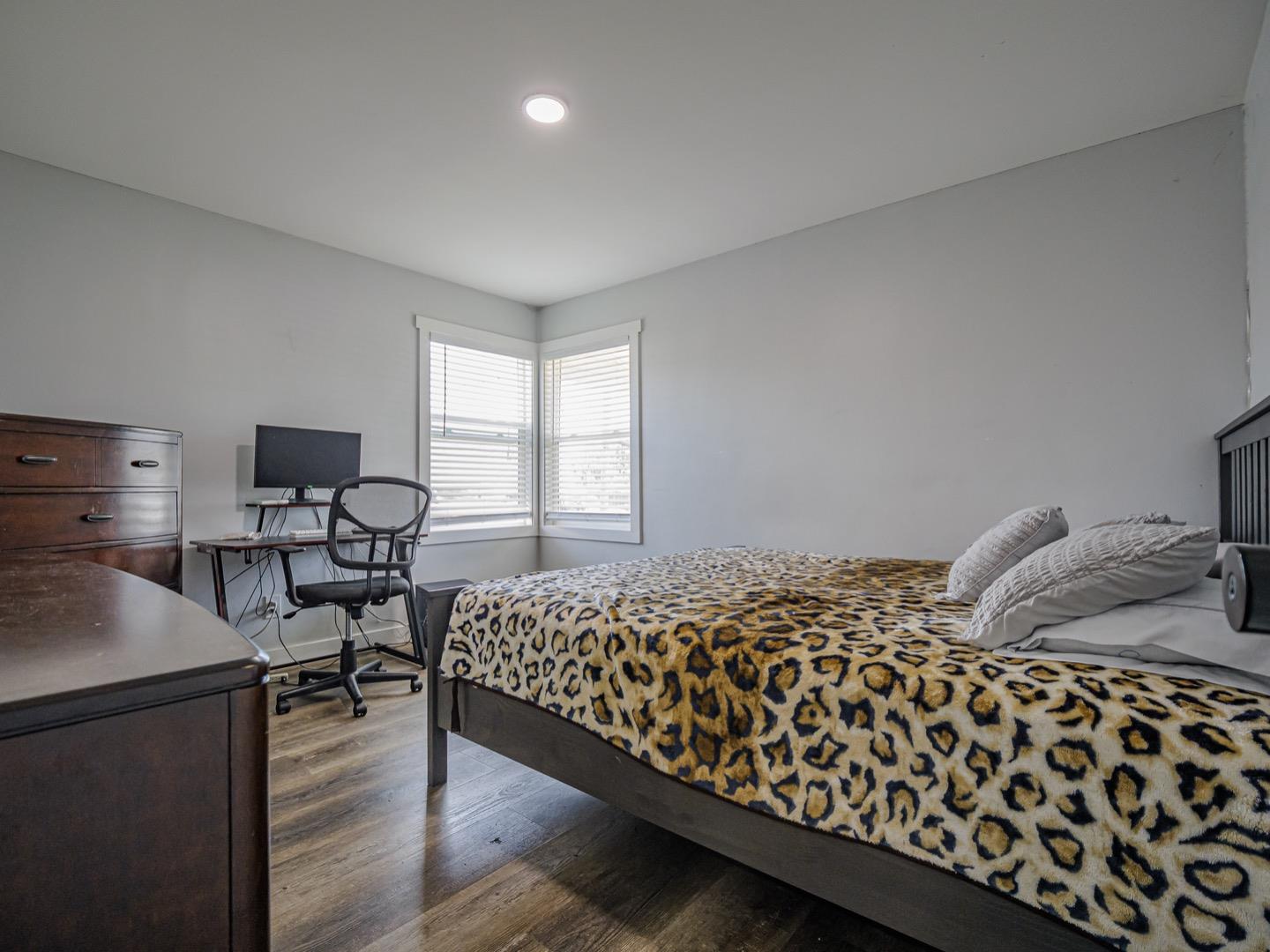 27 Burchell Avenue Watsonville, CA 95076 - Photo 19 of 27 a bedroom with bed and wooden floor