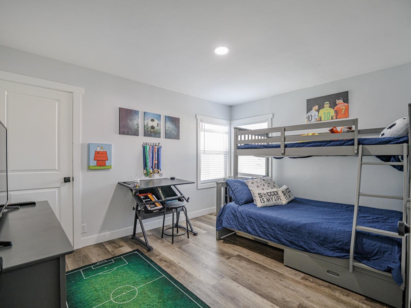 27 Burchell Avenue Watsonville, CA 95076 - Photo 22 of 27 a living room with furniture and a wooden floor