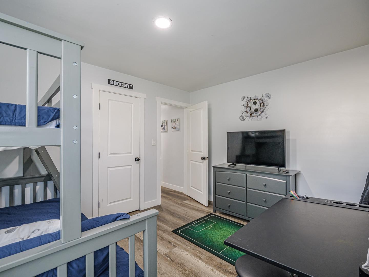 27 Burchell Avenue Watsonville, CA 95076 - Photo 23 of 27 a living room with furniture and a flat screen tv