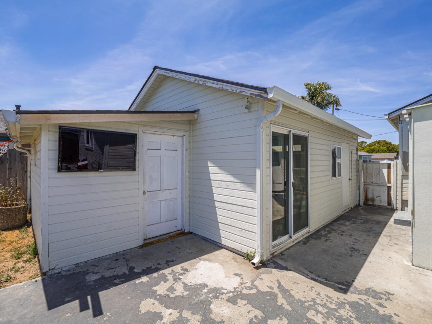 27 Burchell Avenue Watsonville, CA 95076 - Photo 24 of 27 a view of a house with a wooden fence