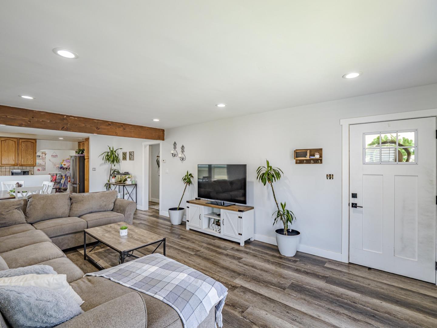 27 Burchell Avenue Watsonville, CA 95076 - Photo 5 of 27 a living room with furniture and a flat screen tv