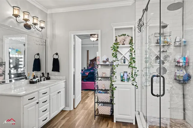 a bedroom with a bed closet and a mirror