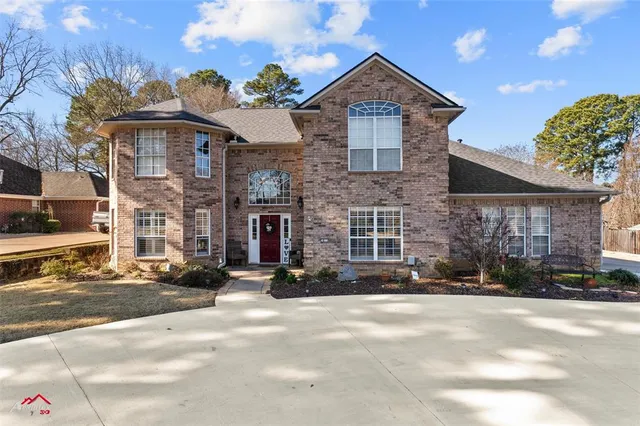a view of a brick building next to a road