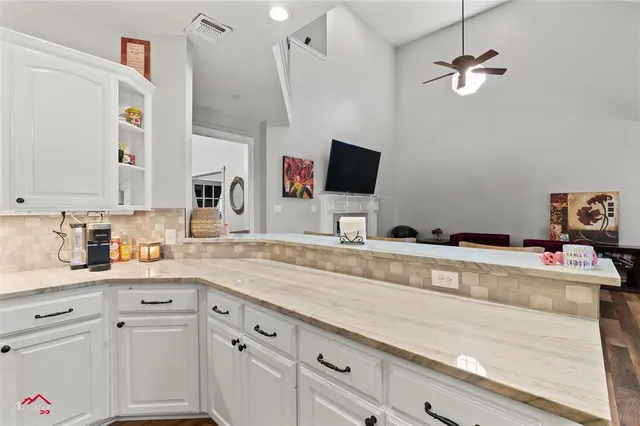a kitchen with a stove and a microwave