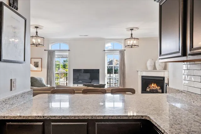 a kitchen with a sink and a fireplace