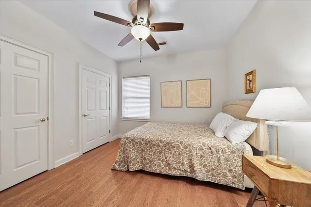 a bedroom with a bed and a lamp