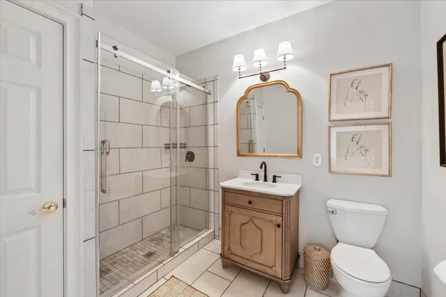 a bathroom with a toilet sink and shower