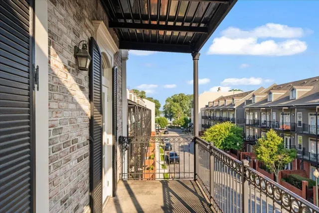 a view of a balcony with wooden floor