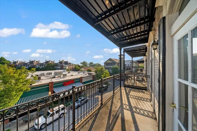 a view of balcony with furniture