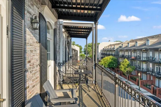a view of a porch with wooden floor