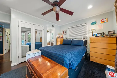 a bed room with a bed and a chandelier