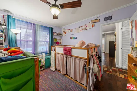 a view of a room with furniture and windows