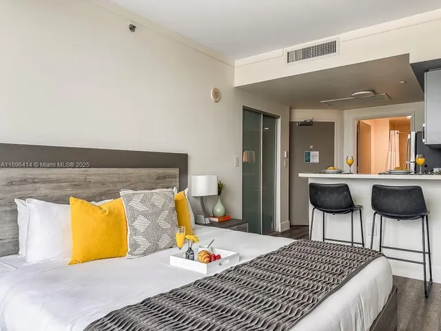 a bedroom with a bed and a chair