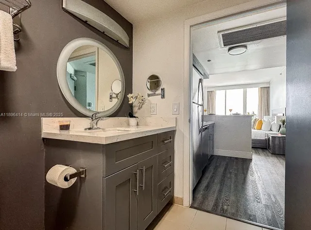 a bathroom with a sink and a mirror