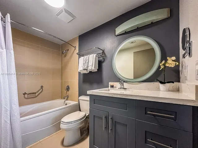 a bathroom with a toilet a sink and a bathtub