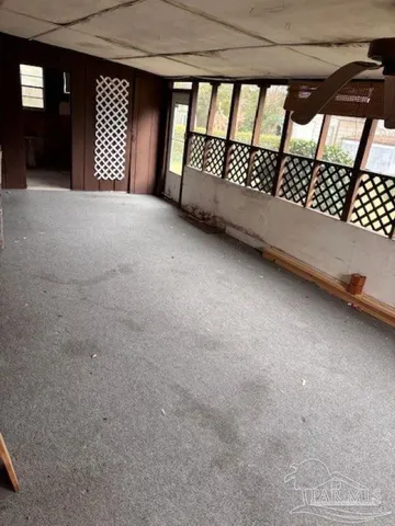 a view of a backyard with swimming pool