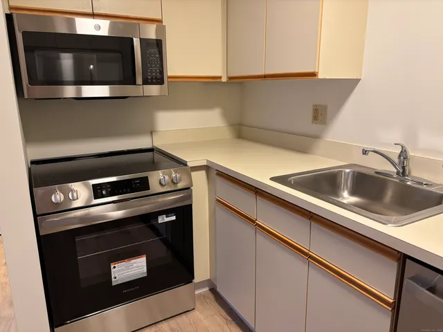 a kitchen with a stove and a microwave