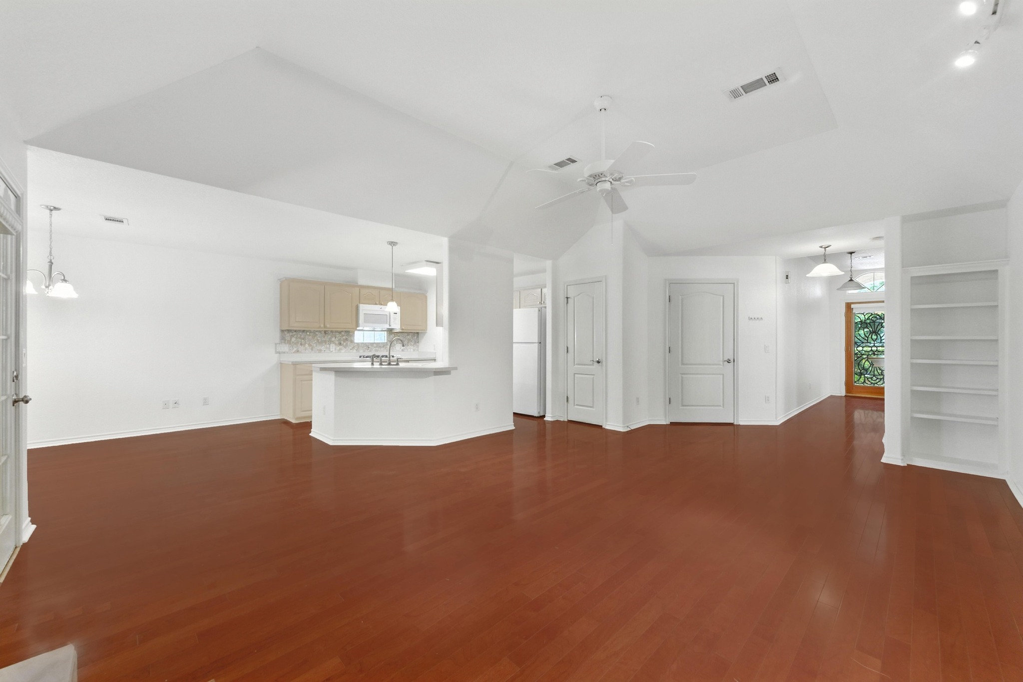 125 Melissa Court Georgetown, TX 78628 - Photo 6 of 29 a view of kitchen and hall with wooden floor and a cabinet