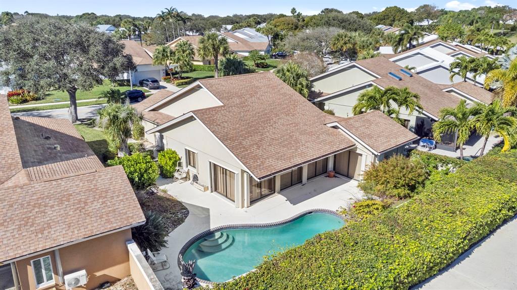 119 Beach Summit Court Jupiter, FL 33477 - Photo 23 of 23 an aerial view of a house with a garden and plants