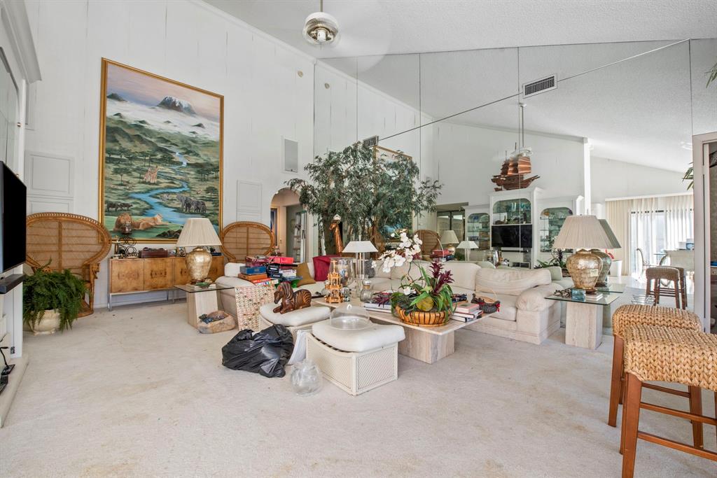 119 Beach Summit Court Jupiter, FL 33477 - Photo 5 of 23 a living room with furniture and a large window