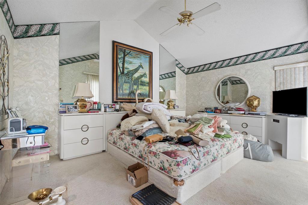 119 Beach Summit Court Jupiter, FL 33477 - Photo 8 of 23 a living room with furniture a fireplace and a flat screen tv