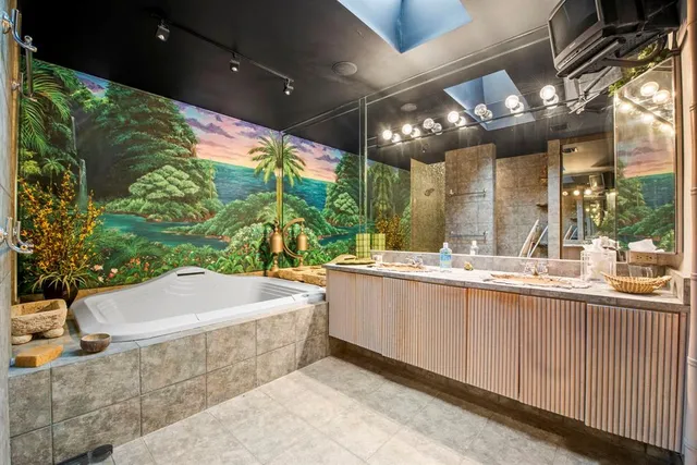 a bathroom with a bathtub and shower