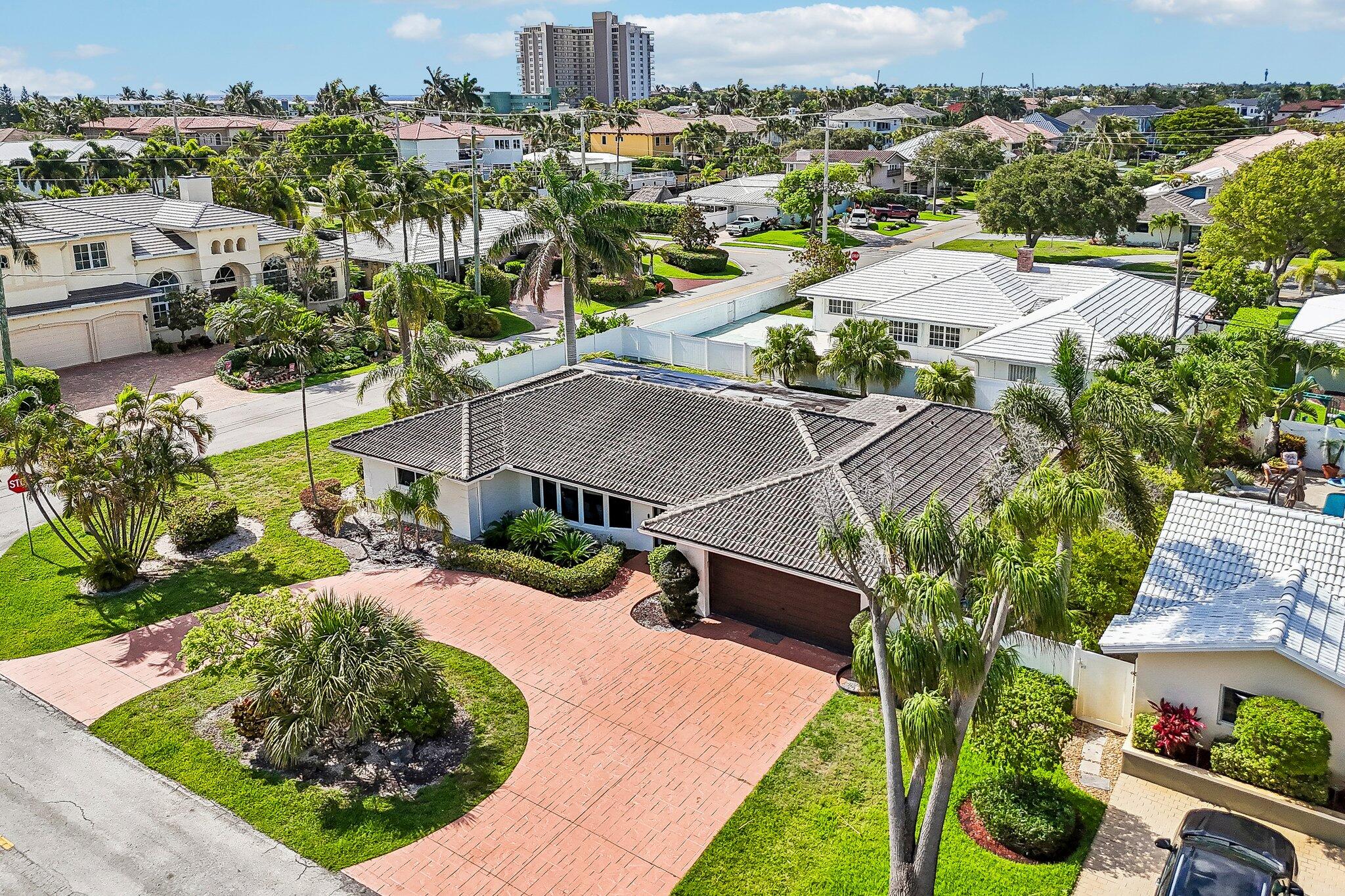 2940 Northeast 39th Court Lighthouse Point, FL 33064 - Photo 4 of 42 an aerial view of a house with yard swimming pool and outdoor seating