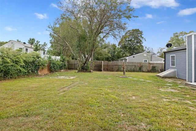 a house view with swimming pool in front of it