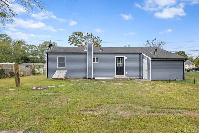 a backyard of a house with a yard and garage