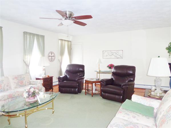 17-23 North Street Three Rivers, MA 01080 - Photo 13 of 29 a living room with furniture and a lamp