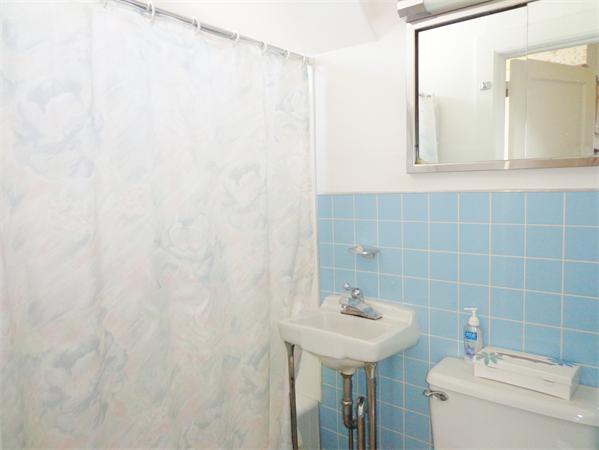 17-23 North Street Three Rivers, MA 01080 - Photo 18 of 29 a bathroom with a sink a toilet and mirror