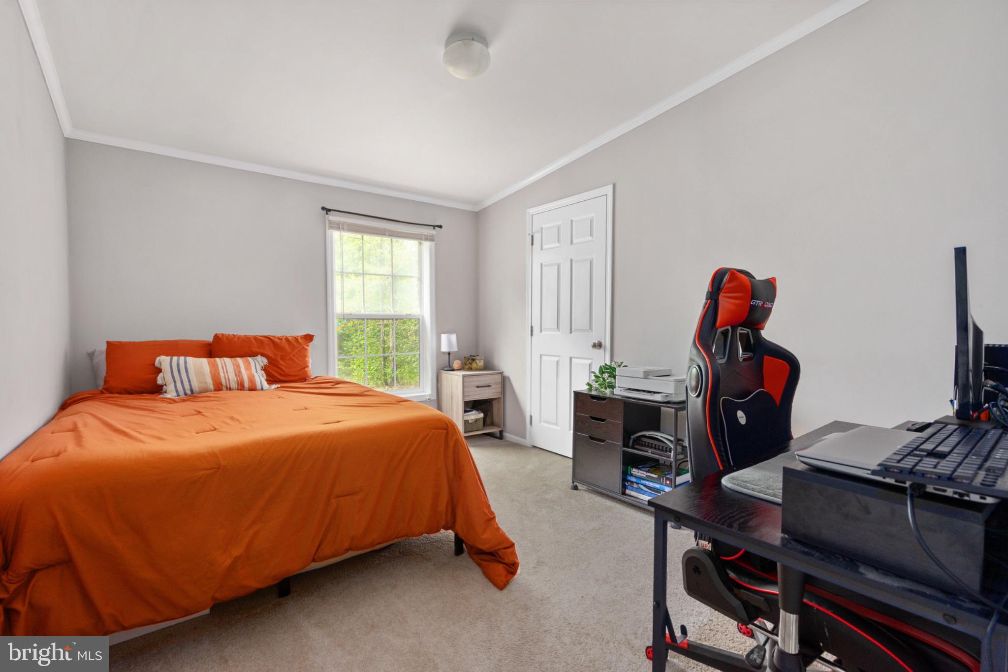 2319 Sizer Road Beaverdam, VA 23015 - Photo 36 of 61 a bedroom with a bed and wooden floor